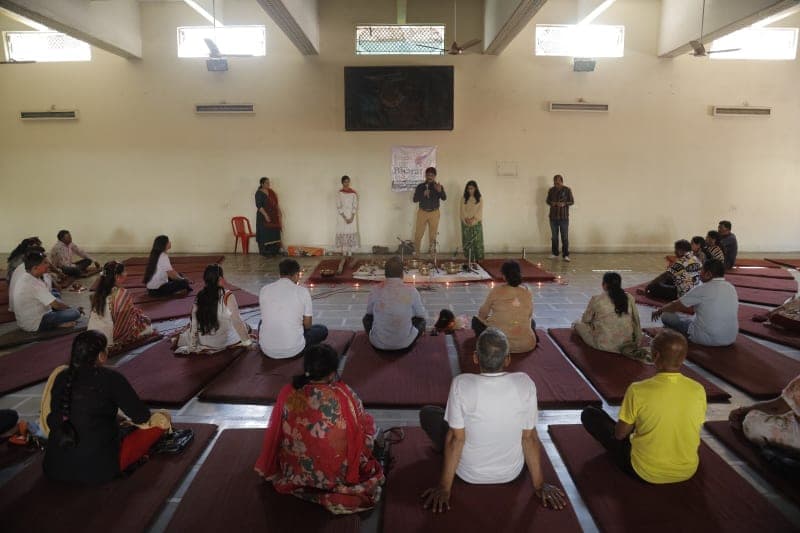 Group celebration on stage during a festive wellness event